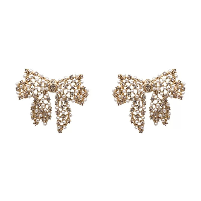 Delicate Pearl Bow Stud Earrings with Gold Detailing – Zelvyn