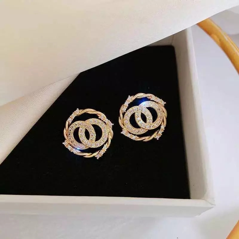 Gold-Tone Twisted Circle Crystal Stud Earrings – Zelvyn